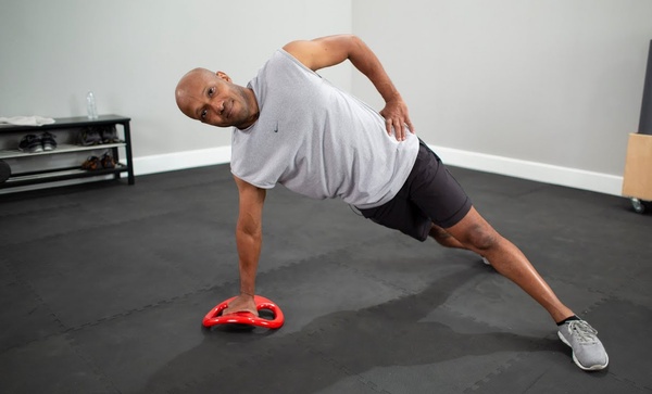 african american male exercising with smartbell