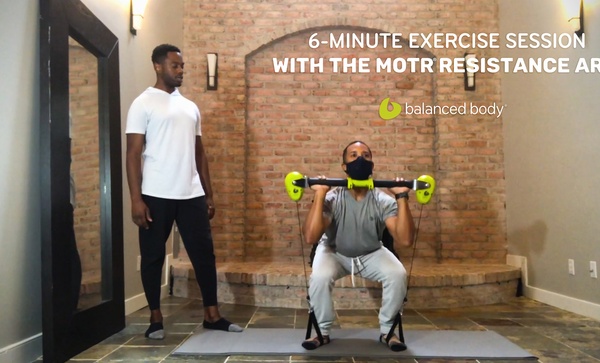 6-minute exercise session with the motr resistance arm african american male instructor teaching student at home