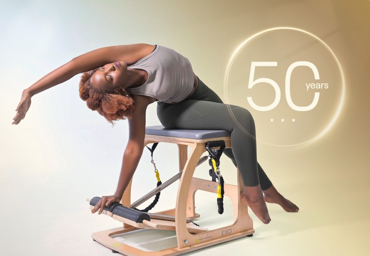 woman doing side bend on exo chair