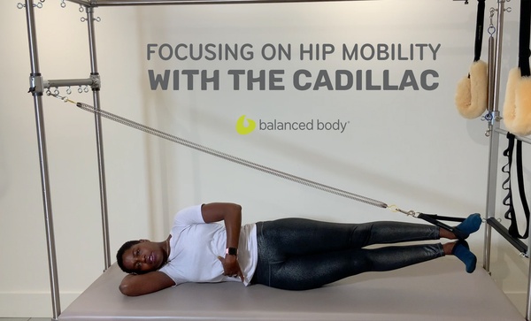 focusing on hip mobility with the cadillac African American woman on trap table